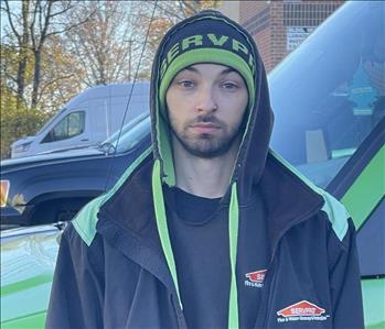 Crew Chief, Alex, standing in front of one of our SERVPRO vehicles.